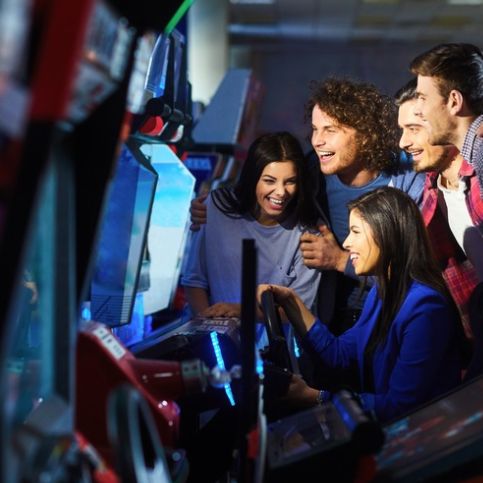 gaming arcade group playing